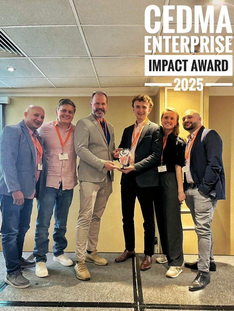 The Databricks team holding the 2025 Impact Award